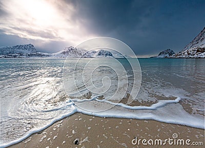 Haukland beach in winter with waves, amazing mountains around, Lofoten Stock Photo