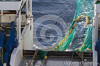 Hauling otter trawl fishing nets Stock Photo