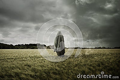 Haunted Spirit Ghost Floating Through a Bleak Landscape Stock Photo