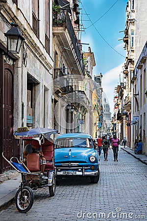 Havana, classic car in small street with view to Capitolio, Cuba Editorial Stock Photo