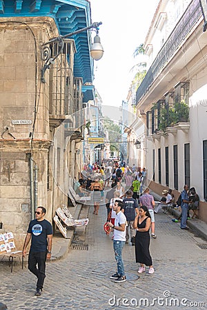 Bar La Bodeguita del medio, on Obispo street. Tourists walking in a daily scene in Old Havana, on a sunny day. Havana, Cuba Editorial Stock Photo