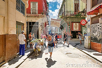 rban scene with people and decaying buildings in Old Havana Editorial Stock Photo