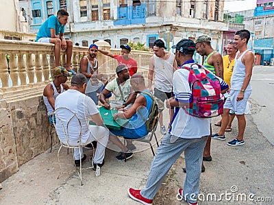 HAVANA, CUBA - OCTOBER 20, 2017: Havana Old Town and Local People Playing Dominoes Editorial Stock Photo