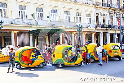 Havana, Cuba - 30/03/2018: Parking taxi tuk- tuks in the historic center of Havana Editorial Stock Photo