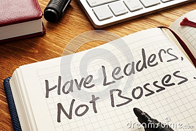 Have Leaders, Not Bosses written in a note. Leadership. Stock Photo