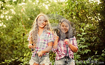 Having fun. Fly fishing. Kids spend time together fishing. Fishing skills. Summer hobby. Happy smiling children with net Stock Photo