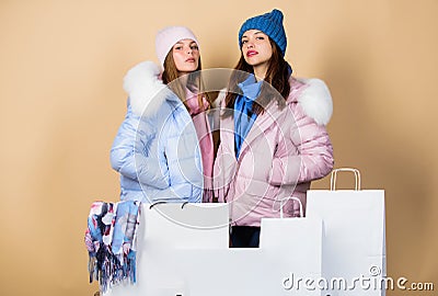 Having fun together. Black friday. Buy winter clothes. Sale and discount. Women friends shopping winter clothes Stock Photo