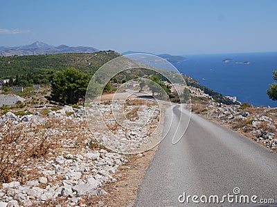 Having a ride near Dubrovik, Croatia - mountain road, car bonnet and coast line view Stock Photo