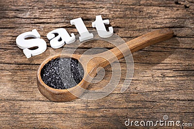 Hawaii black salt on wooden spoon Stock Photo