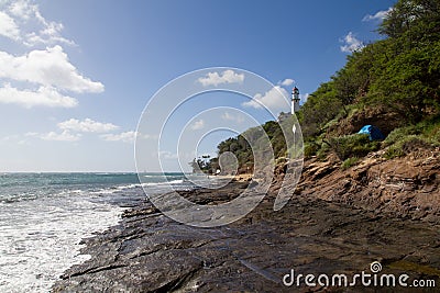 Hawaii Lava Rock Beach with Lighthouse Stock Photo