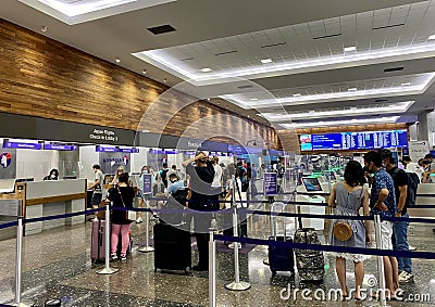 Hawaiian Airlines passengers line at check-in of International Airport in Honolulu Editorial Stock Photo