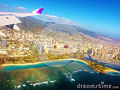 Hawaiian airlines wing of plane above honolulu Editorial Stock Photo