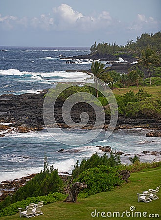 Hawaiian beach with lunch chairs. Enjoying paradise in Aloha. Panorama tropical landscape of summer scenery with palm Stock Photo