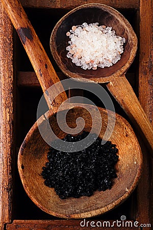 Hawaiian Black lava sea salt in rustic wooden spoon Stock Photo