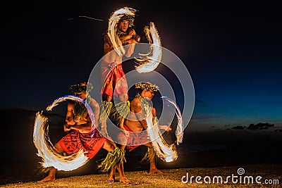 Hawaiian FIre Dancers in the Ocean Stock Photo