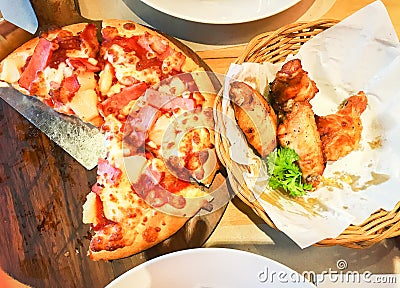 Hawaiian pan pizza with spicy wing chicken for lunch Stock Photo