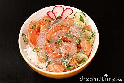 Hawaiian poke with salmon and sesame seeds, boiled rice, fresh c Stock Photo