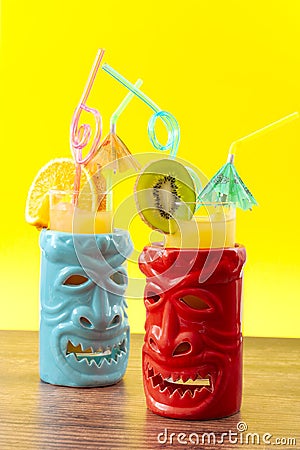 Hawaiian tiki bar, summer refreshing drinks and tropical cocktails concept theme with glasses of alcohol and juice mixed together Stock Photo