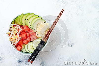 Hawaiian watermelon poke bowl with avocado, cucumber, mung bean sprouts and pickled ginger. Top view, overhead Stock Photo