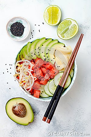 Hawaiian watermelon poke bowl with avocado, cucumber, mung bean sprouts and pickled ginger. Top view, overhead Stock Photo