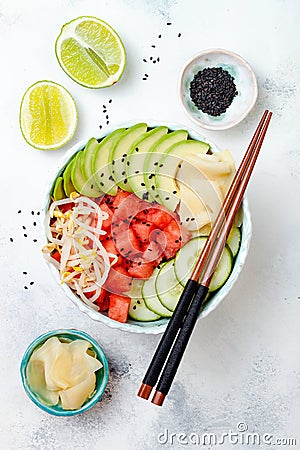 Hawaiian watermelon poke bowl with avocado, cucumber, mung bean sprouts and pickled ginger. Top view, overhead Stock Photo