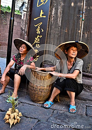 Hawkers and peddlers selling food and grocery in walking street Editorial Stock Photo