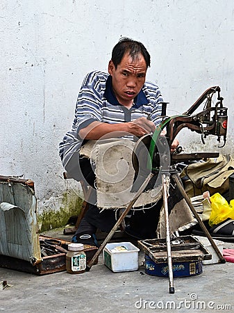 Hawkers and peddlers selling food and grocery in walking street Editorial Stock Photo