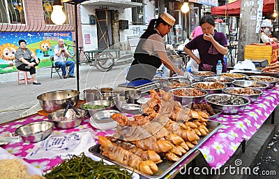 Hawkers and peddlers selling food and grocery in walking street Editorial Stock Photo