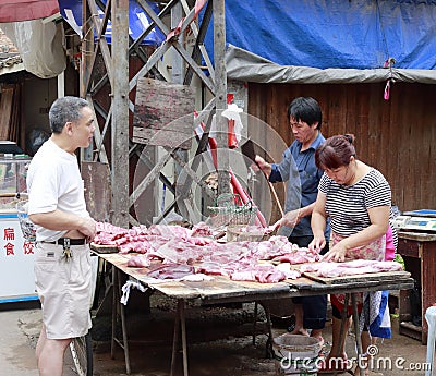 Hawkers sell pork Editorial Stock Photo