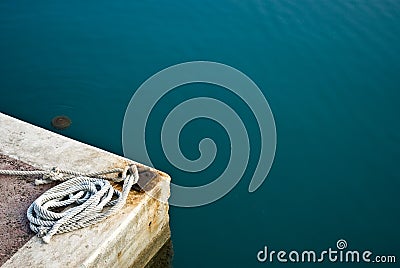 Hawser rope in port against sea Stock Photo