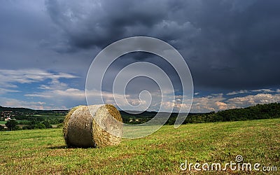 Hay bale farm / Hay bale on the field after harvest, Hungary Stock Photo