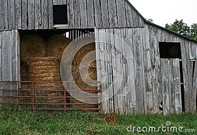 Hay Bales in Barn Stock Photo