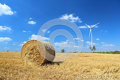 Hay bales and wind turbine Stock Photo