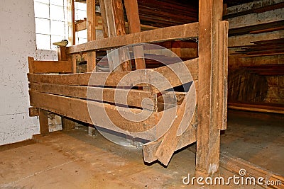 An hay manger for feeding livestock in a barn Stock Photo