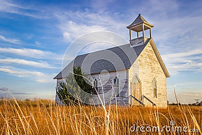 Hays, KS USA - Abandoned Wooden Church Building in a meadow of Hays, KS USA Stock Photo