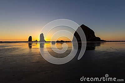 Cannon Beach Low Tide Sunset Stock Photo