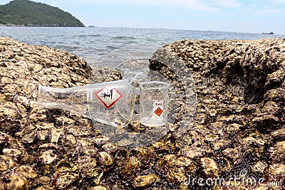 Hazardous chemical waste from the industry on rocks Stock Photo