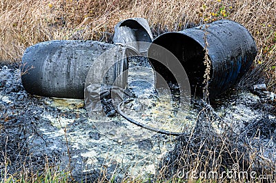 Hazardous waste. Spillage of toxic waste in nature Stock Photo