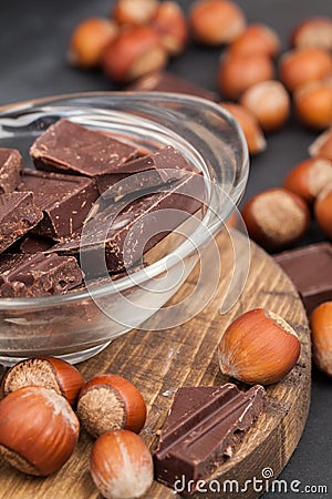 Hazelnut and chocolate on wood Stock Photo