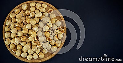 Hazelnut nut or noisettes nuts group Protein and healthy food for diet in a wooden plate Stock Photo