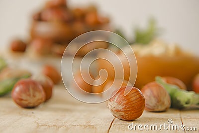 Hazelnuts in rustic style. Hazelnuts abundance.Vegetable protein and healthy fat source. Whole and shelled organic Stock Photo