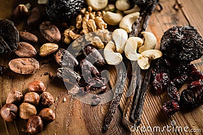 Hazelnuts, walnuts, cashews and vanilla orchid pod Stock Photo