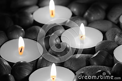 Hazelnuts, walnuts and pecan nuts with tea light candles Stock Photo