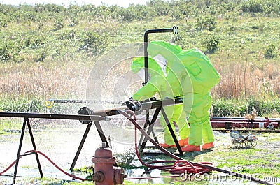 Hazmat team stopping leak Stock Photo