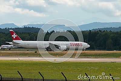 HB-JNA Swiss Boeing 777-3DEER jet in Zurich in Switzerland Editorial Stock Photo