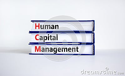 HCM, Human capital management symbol. Concept words HCM, Human capital management on books on a beautiful white background. Stock Photo