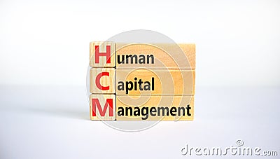 HCM, Human capital management symbol. Concept words HCM, Human capital management on wooden blocks on a beautiful white background Stock Photo