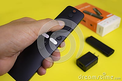 Xiaomi mi tv stick with android tv and remote control in smart tv Stock Photo