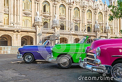 HDR - American colorfully convertible vintage cars parked on the side strip before aGran teatro in Havana Cuba - Serie Cuba Report Stock Photo