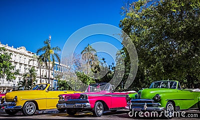 HDR - Beautiful american convertible vintage cars parked in series in Havana Cuba before the gran teatro - Serie Cuba Reportage Stock Photo